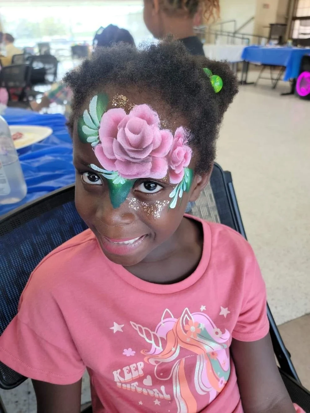 Pink flower and leaf face painting
